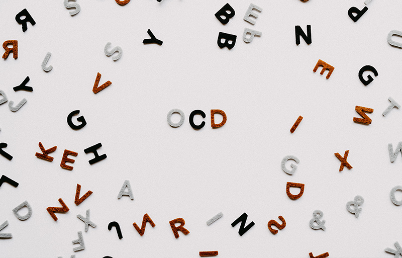 A page scattered with letters of the alphabet representing ocd